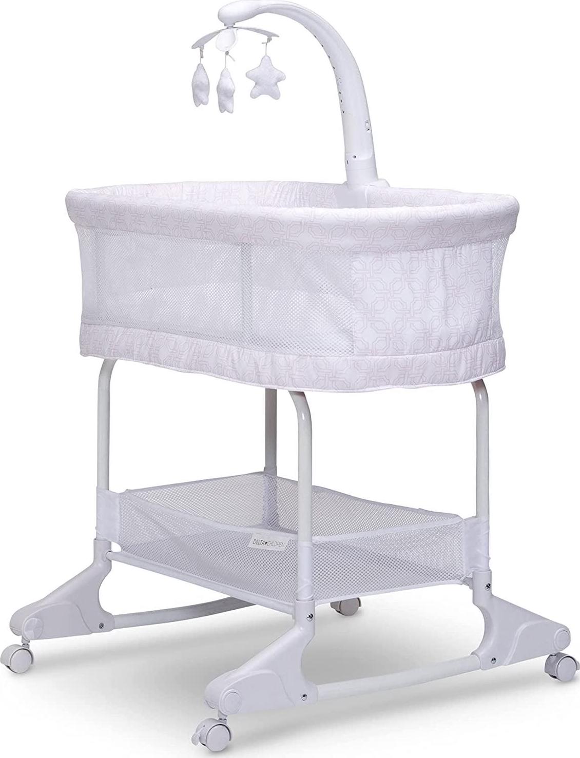 Delta Children SleepCool Rocking Bassinet with Airflow Mesh. Pink Fresco